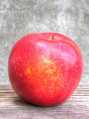 Red apple on grunge background