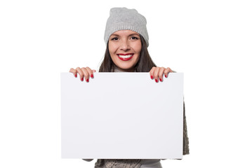 Smiling woman holding a blank sign