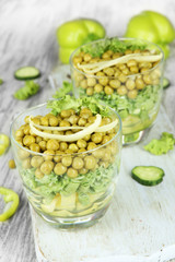 Tasty salad with fresh vegetables on wooden table