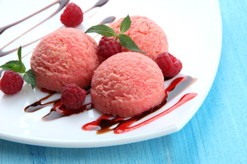 Delicious ice cream on plate on table close-up