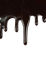 Melted chocolate dripping on white background