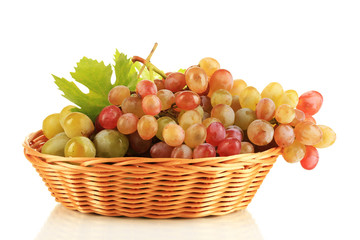Ripe sweet grape in basket, isolated on white