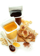 Tasty desserts in open plastic cups and honey combs, cookies,
