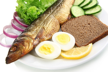 Smoked fish on plate close up