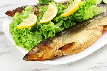 Smoked fish on plate close up
