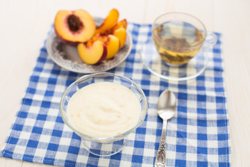 Breakfast. Green tea, youghurt and peach
