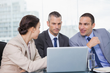 Fototapeta premium Pensive colleagues working together on their laptop