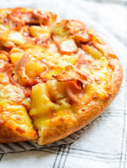 Delicious Pizza with bacon and pineapple