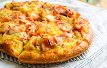 Delicious Pizza with bacon and pineapple