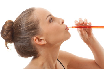 woman drinks red liquid from a test tube
