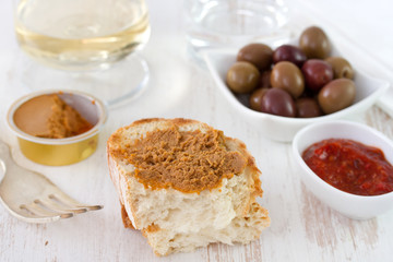 sardine pate with bread, sauce and olives