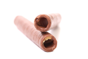 Waffle rolls coated chocolate.