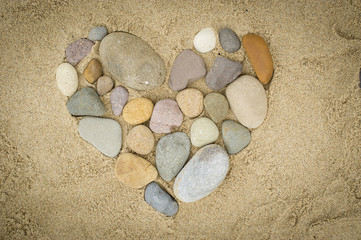 Fototapeta na wymiar Pebbles arranged in a heart shape