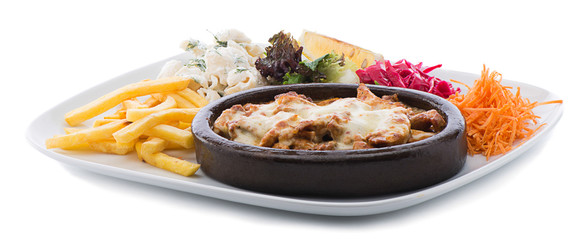 Chicken casserole on a terracotta plate with salad