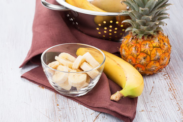 Banana sliced in bowl  and pineapple