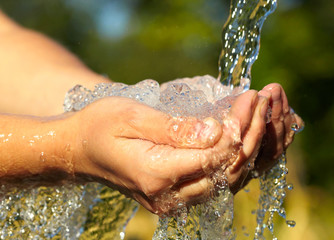 Woman's hands with water splash - 56384031