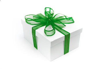 Christmas present wrapped with a green ribbon and bow.