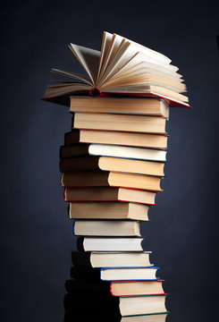 Pile of books on a black background