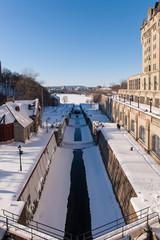 Sluice gate on Rideau Canal in winter time in Ottawa, Canada