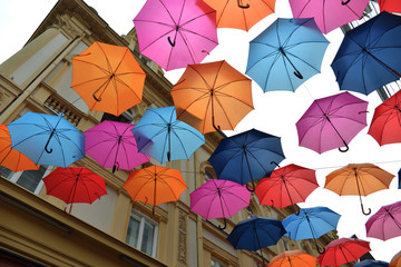 Umbrellas and a city