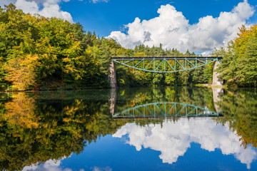 Fototapeta premium Old railroad bridge over the river Radunia, Poland.