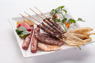 Grilled meat on white dish
