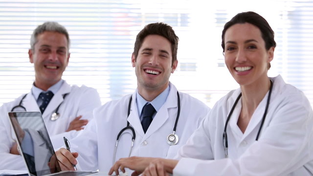Team of doctors laughing together