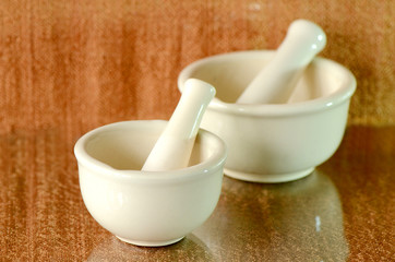 Porcelain medicine grinder.