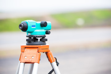 Land surveying equipment theodolite during road works