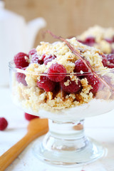 glass of raspberry dessert on a white background teapot