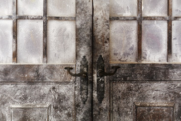 Snowy and icy decorated old styled doors