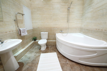 Naklejka na ściany i meble Light and clean bathroom with toilet with tiles on floor
