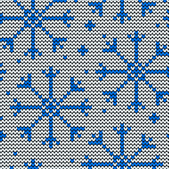 Knitted seamless winter pattern with snowflakes