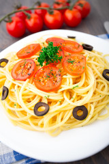 Pasta sliced with cherry tomatoes