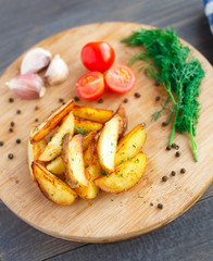 Fried potato wedges with cherry tomato