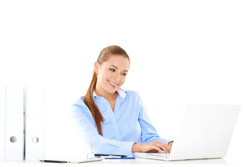 Smiling businesswoman working on a laptop