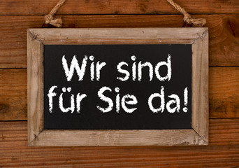 Wir sind f&uuml;r Sie da! Holzschild