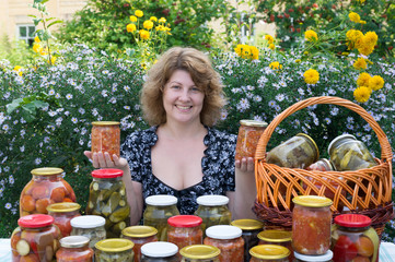 Woman with home canning for the winter