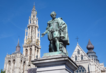 Fototapeta na wymiar Antwerp - Statue of painter P. P. Rubens and tower of cathedra