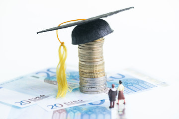 Education fund concept with miniature people and Euro banknotes