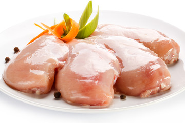 Raw chicken breasts on white background