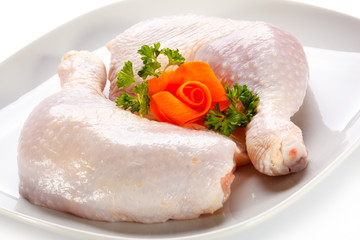 Raw chicken legs on white background