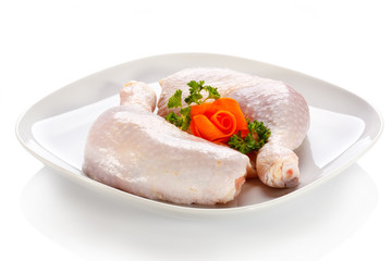 Raw chicken legs on white background