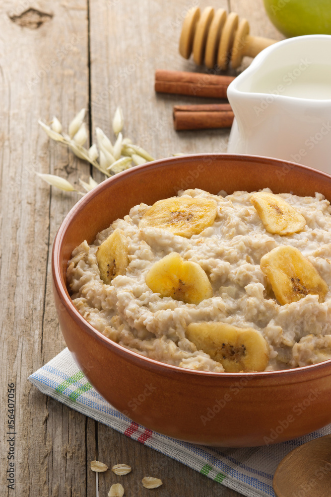 Sticker bowl of oatmeal on wood