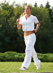 Woman Runner. Fitness Girl Running outdoors. jogger