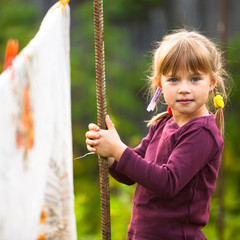 Sweet funny girl with the clothesline