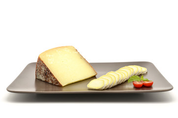 Pecorino di Pienza, italian sheep cheese and sliced ​​camembert