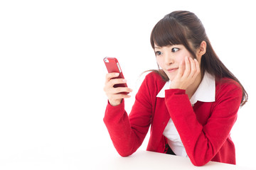 Naklejka premium attractive asian woman using smart phone