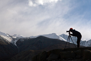 Photographer take a photo in the mountain