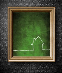 Home icon symbol with copy-space chalkboard in old wooden frame
